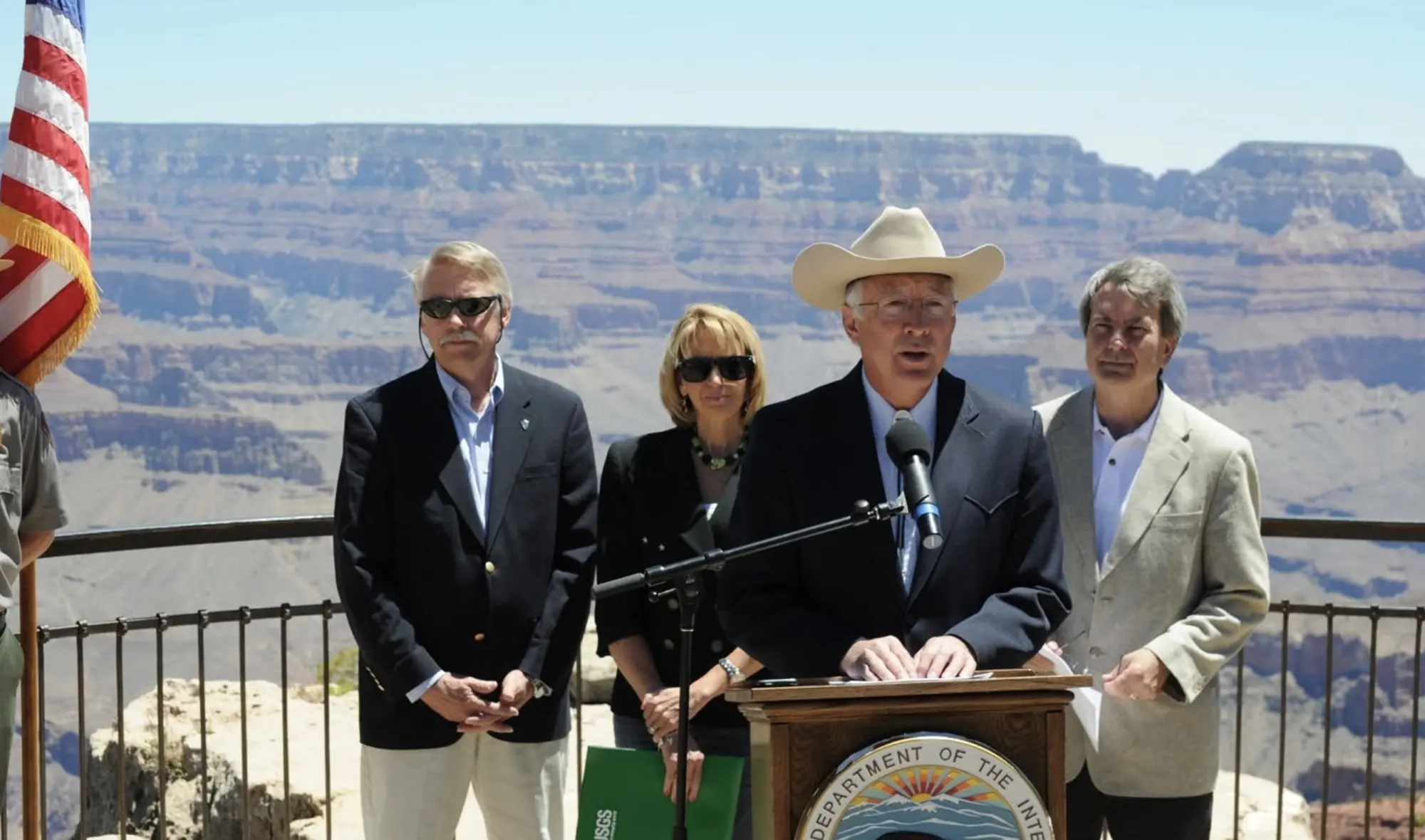Ken Salazar speaking at a Department of the Interior podium on the rim of the Grand Canyon